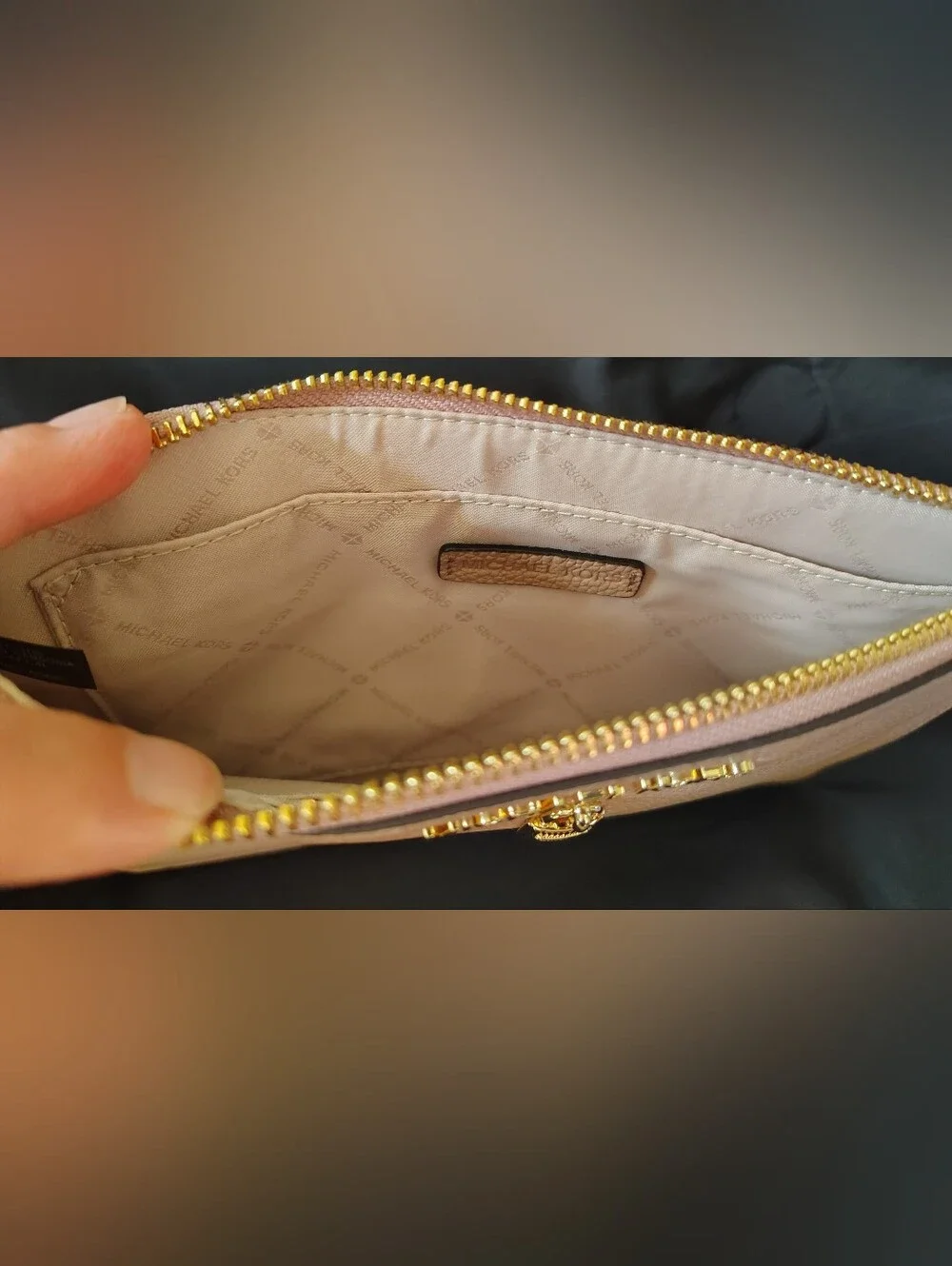 Michael Kors XL Wristlet Pebbled Leather with Gold Tone Lock Detail.